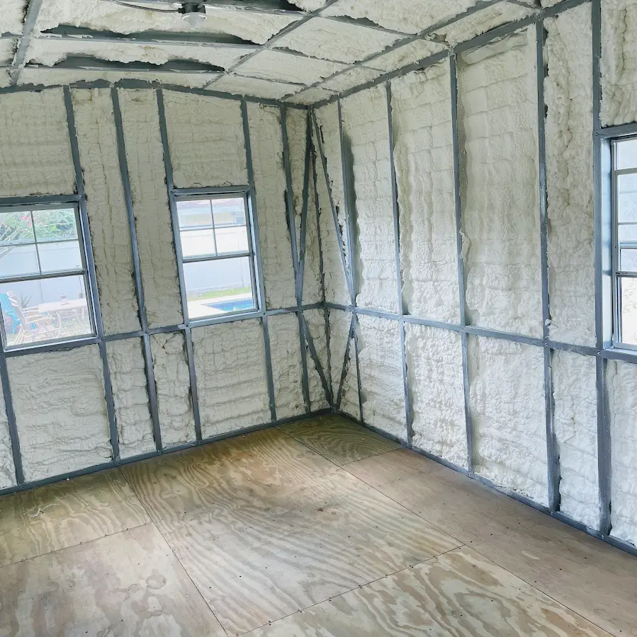 Closed-cell spray foam insulation applied to wall cavities in a residential project in Liberal